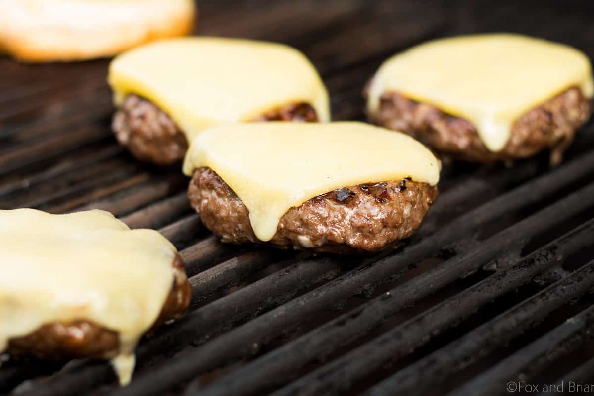 These Shallot White Cheddar Burgers use shallots to flavor the burger, and are topped with white cheddar and a garlic aioli for a flavor bomb gourmet burger!