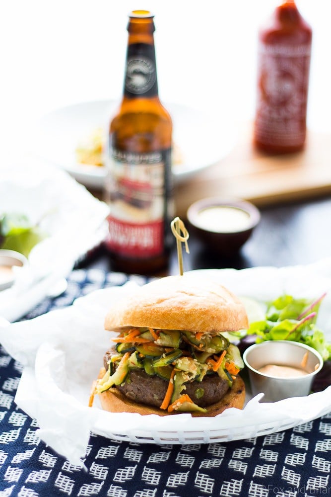 These Asian Bison Burgers are just the thing to change up your grilling routine! Lean ground bison burgers full of asian flavors and topped with a sriracha aioli!