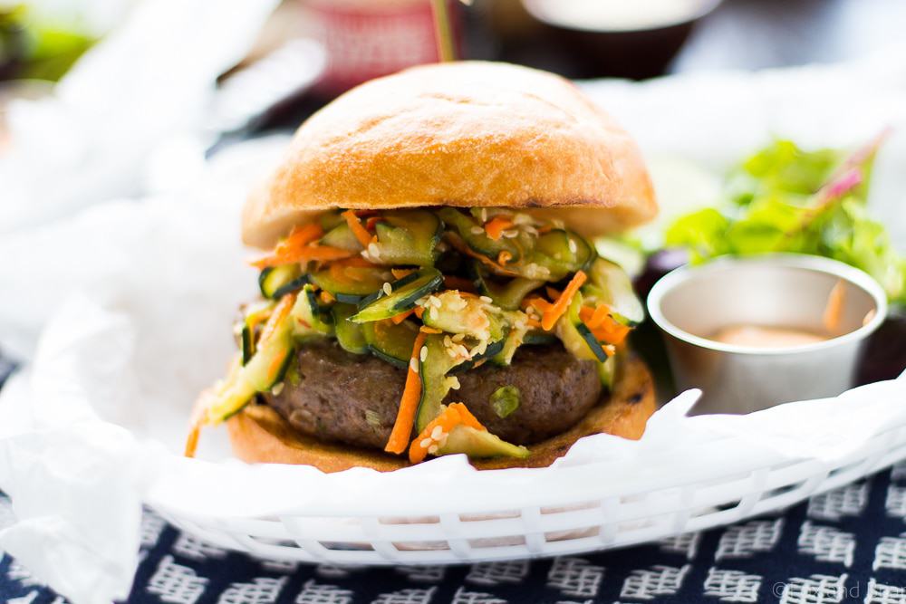 These Asian Bison Burgers are just the thing to change up your grilling routine! Lean ground bison burgers full of asian flavors and topped with a sriracha aioli!