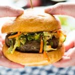 These Asian Bison Burgers are just the thing to change up your grilling routine! Lean ground bison burgers full of asian flavors and topped with a sriracha aioli!