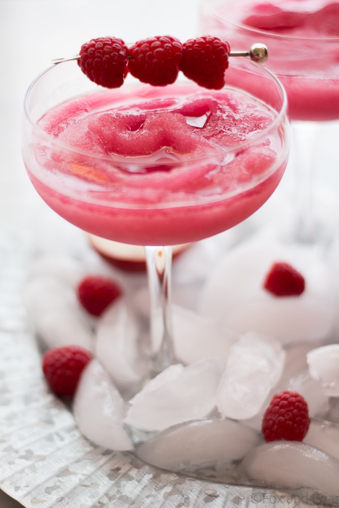Your summer drink dreams came true! Raspberry Peach Frosé (Frozen rosé) is a frozen rosé blended into a frosty pink drink that will keep you cool while you say "Yes way rosé!"
