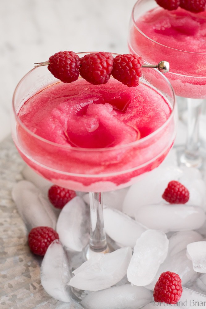 Your summer drink dreams came true! Raspberry Peach Frosé (Frozen rosé) is a frozen rosé blended into a frosty pink drink that will keep you cool while you say "Yes way rosé!"