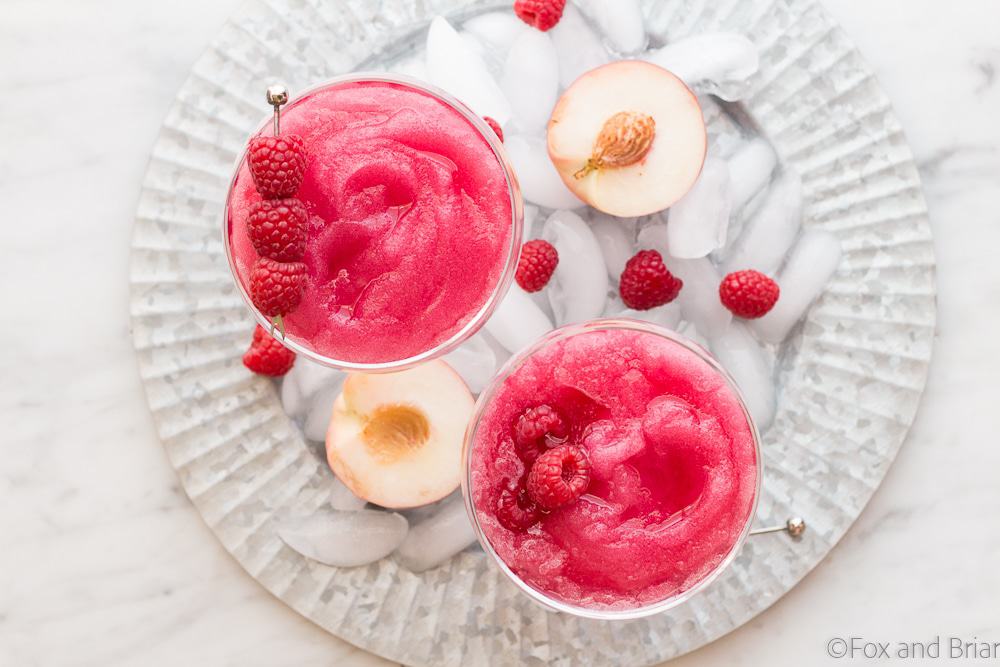 Your summer drink dreams came true! Raspberry Peach Frosé (Frozen rosé) is a frozen rosé blended into a frosty pink drink that will keep you cool while you say "Yes way rosé!"