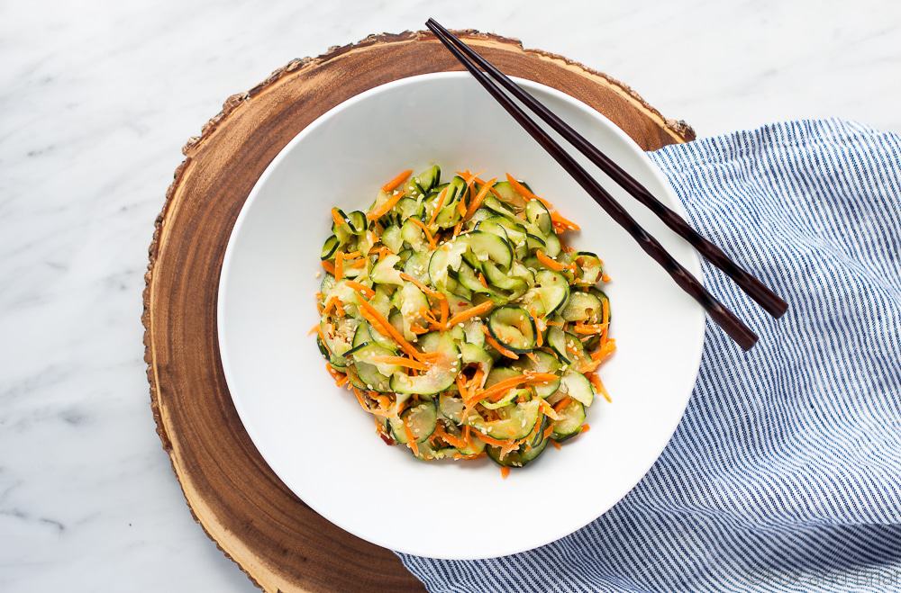 This Sesame Carrot and Cucumber Slaw is a cool and crisp side dish perfect for hot weather! It takes under 15 minutes to make, and is vegan and gluten free!