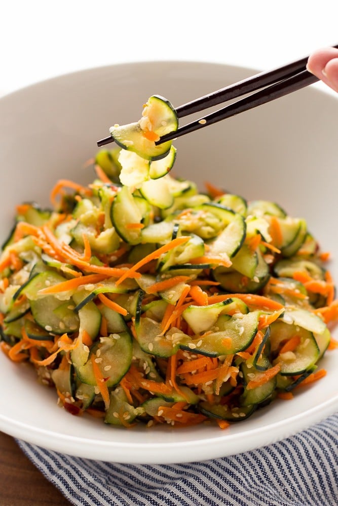 This Sesame Carrot and Cucumber Slaw is a cool and crisp side dish perfect for hot weather! It takes under 15 minutes to make, and is vegan and gluten free!