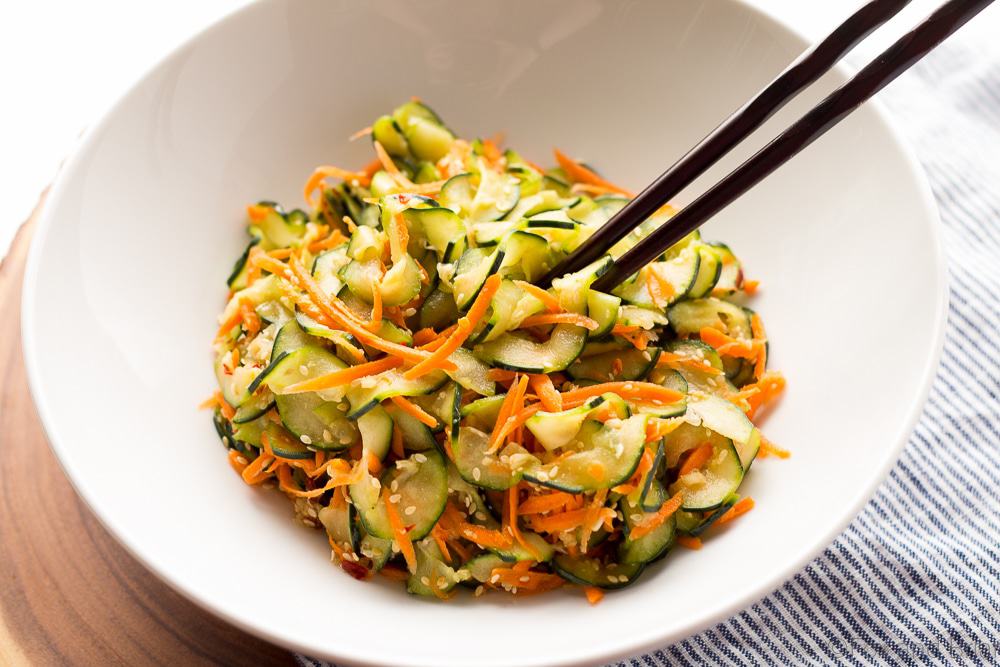 This Sesame Carrot and Cucumber Slaw is a cool and crisp side dish perfect for hot weather! It takes under 15 minutes to make, and is vegan and gluten free!