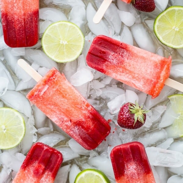These Strawberry Limeade popsicles are easy to make and require only three ingredients! Whip up this simple recipe and have a cool treat on a hot day.