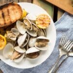 Learn how to make this simple recipe for Beer Steamed Clams - so easy you can even make them on the campfire! Includes instructions for cooking at home or on the campfire.