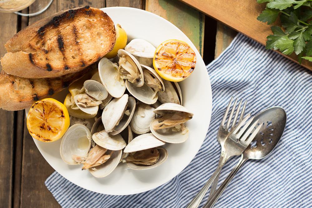 Learn how to make this simple recipe for Beer Steamed Clams - so easy you can even make them on the campfire! Includes instructions for cooking at home or on the campfire.