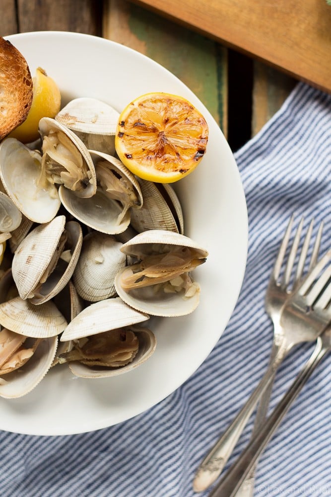 Learn how to make this simple recipe for Beer Steamed Clams - so easy you can even make them on the campfire! Includes instructions for cooking at home or on the campfire.