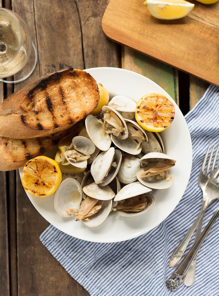 Learn how to make this simple recipe for Beer Steamed Clams - so easy you can even make them on the campfire! Includes instructions for cooking at home or on the campfire.