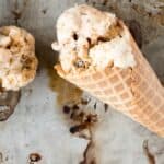 This easy recipes for No churn S'mores Ice Cream starts with a toasted marshmallow ice cream base, and mixes in crushed graham crackers and a rich chocolate sauce. Your favorite campfire treat in ice cream form!