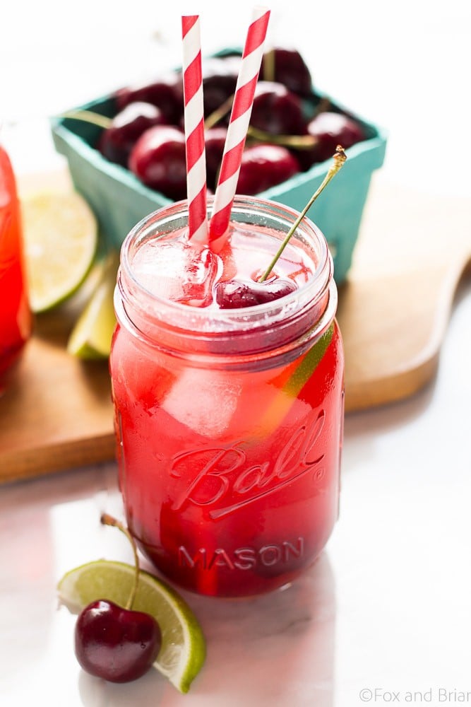 This Sparkling Cherry Limeade uses only four real ingredients - cherries, limes, water and sugar! Cherry Simple syrup mixes with lime juice and sparkling water to make a refreshing summer beverage that everyone can enjoy!