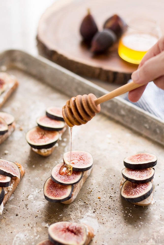 These Fig and Goat Cheese Crostini with Honey are one of my favorite simple summer appetizers. Using fresh figs, goat cheese, honey and pepper, these are an easy but elegant starter or snack.