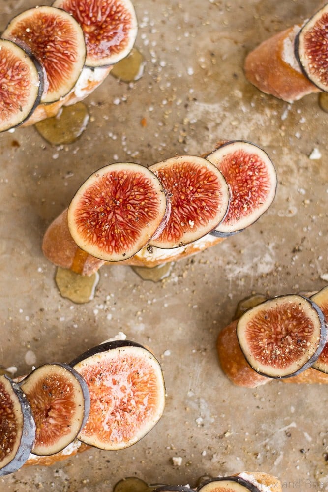 These Fig and Goat Cheese Crostini with Honey are one of my favorite simple summer appetizers. Using fresh figs, goat cheese, honey and pepper, these are an easy but elegant starter or snack.