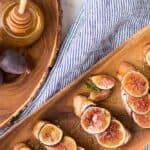 These Fig and Goat Cheese Crostini with Honey are one of my favorite simple summer appetizers. Using fresh figs, goat cheese, honey and pepper, these are an easy but elegant starter or snack.