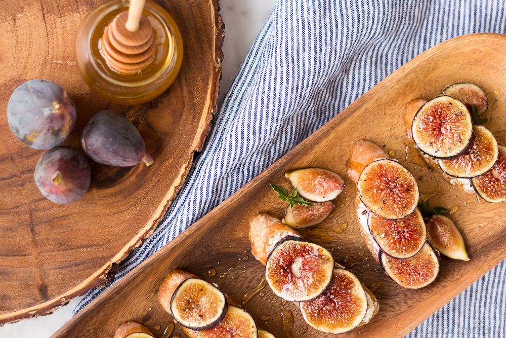 These Fig and Goat Cheese Crostini with Honey are one of my favorite simple summer appetizers. Using fresh figs, goat cheese, honey and pepper, these are an easy but elegant starter or snack.