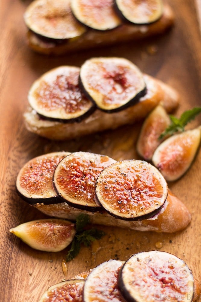 These Fig and Goat Cheese Crostini with Honey are one of my favorite simple summer appetizers. Using fresh figs, goat cheese, honey and pepper, these are an easy but elegant starter or snack.