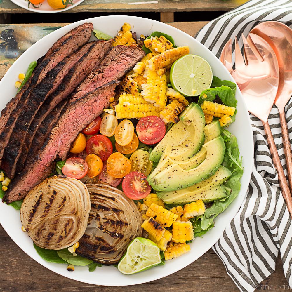 This Mexican Grilled Flank Steak Salad with Honey Lime Dressing has a smoky spiced grilled flank steak, charred corn, grilled onions, creamy avocado and a zingy honey lime dressing. Quick to make inside on the stove or outside on the grill!