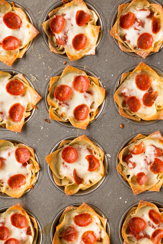These cute Mini Pizza Dip Cups are cheesy and delicious! Perfect for your next party, game day or tailgate!