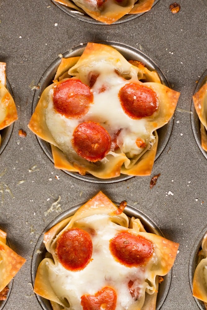 These cute Mini Pizza Dip Cups are cheesy and delicious! Perfect for your next party, game day or tailgate!