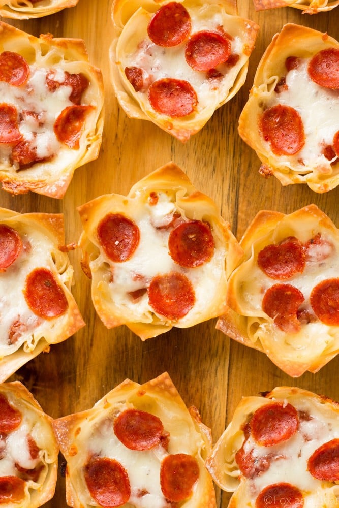 These cute Mini Pizza Dip Cups are cheesy and delicious! Perfect for your next party, game day or tailgate!