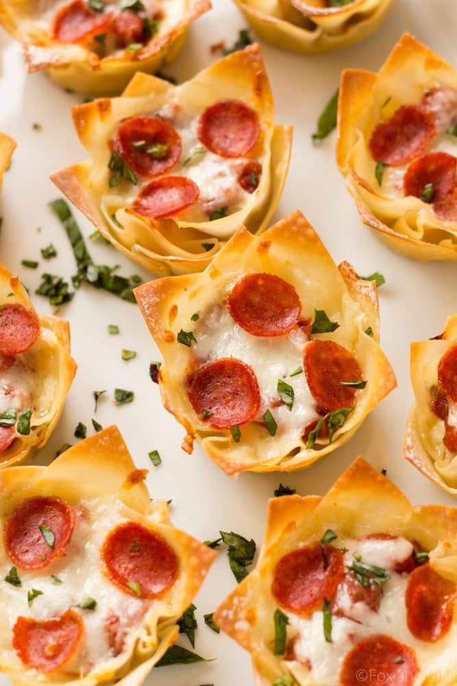 These cute Mini Pizza Dip Cups are cheesy and delicious! Perfect for your next party, game day or tailgate!