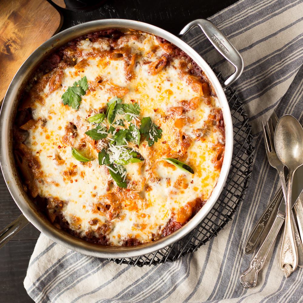 This easy One Pot Pasta Bake with Sausage and Wine only uses one pan - you don't even need to boil the noodles! It only takes about ten minutes to prep, then just bake it in the oven while you do something else! You won't believe how easy it is to make this delicious, cheesy pasta dinner! #sponsored #TasteofItaly
