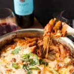 This easy One Pot Pasta Bake with Sausage and Wine takes only uses one pan - you don't even need to boil the noodles! It only take about ten minutes to prep, then bake it in the oven while you do something else! You won't believe how easy it is to make this delicious, cheesy pasta dinner! #sponsored #TasteofItaly