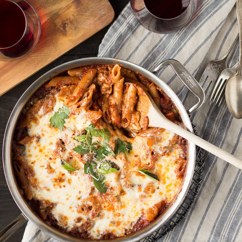 This easy One Pot Pasta Bake with Sausage and Wine only uses one pan - you don't even need to boil the noodles! It only takes about ten minutes to prep, then just bake it in the oven while you do something else! You won't believe how easy it is to make this delicious, cheesy pasta dinner! #sponsored #TasteofItaly