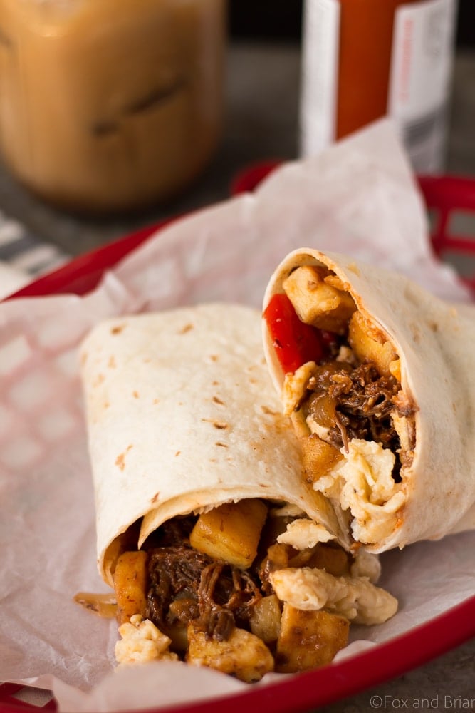 These Make Ahead Beef Breakfast Burritos are freezer friendly! Using tender, slow cooker shredded beef, breakfast potatoes, eggs and cheese, they can be made ahead of time and frozen. Just reheat them in the morning for a quick and hearty breakfast! #sponsored #WABeefLove