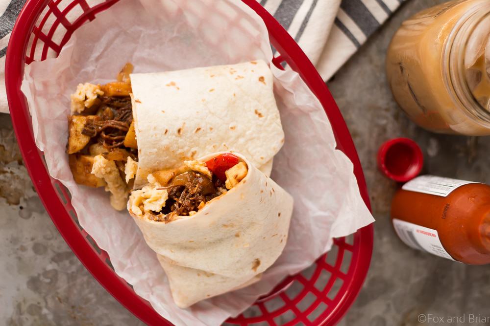 These Make Ahead Beef Breakfast Burritos are freezer friendly! Using tender, slow cooker shredded beef, breakfast potatoes, eggs and cheese, they can be made ahead of time and frozen. Just reheat them in the morning for a quick and hearty breakfast! #sponsored #WABeefLove