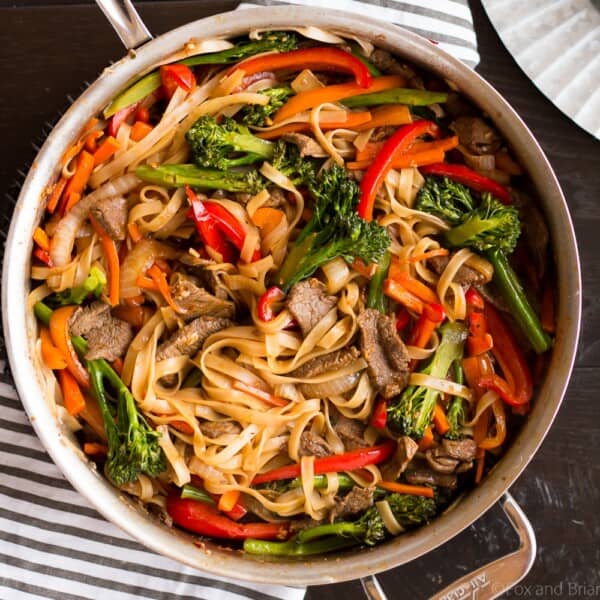 This quick and easy Beef Noodle Stir Fry takes under 30 minutes and is easily made gluten free! Full of veggies, beef and a flavorful sauce, your whole family will love it!