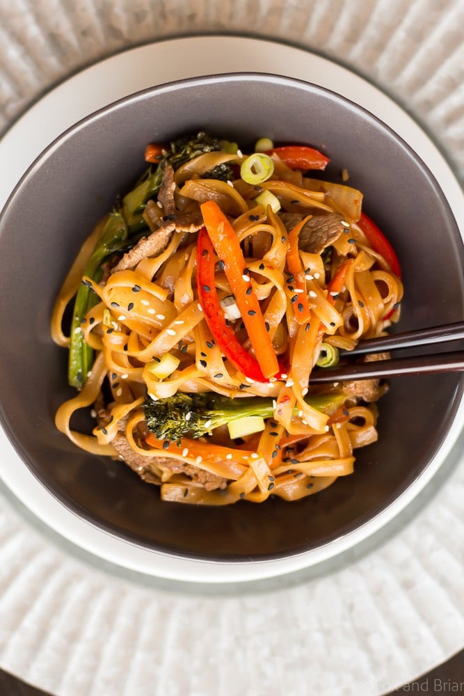 This quick and easy Beef Noodle Stir Fry takes under 30 minutes and is easily made gluten free! Full of veggies, beef and a flavorful sauce, your whole family will love it!