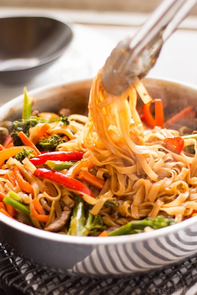 This quick and easy Beef Noodle Stir Fry takes under 30 minutes and is easily made gluten free! Full of veggies, beef and a flavorful sauce, your whole family will love it!