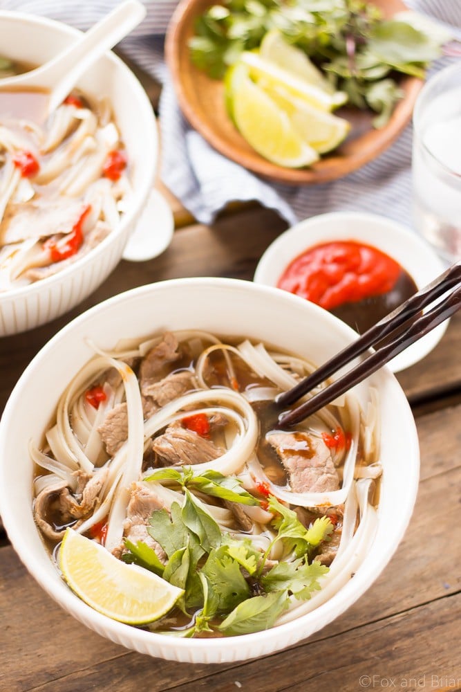 This easy Slow Cooker Beef Pho simmers away all day, creating a flavorful broth that you and your family can enjoy on a cold day! #sponsored