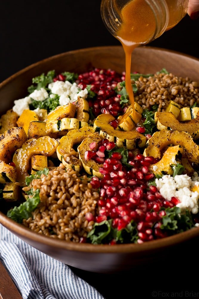 This Autumn Harvest Salad uses the beautiful produce available as the months start to get colder, such as delicata squash, kale, and pomegranates, as well as farro and goat cheese to make a hearty cold weather salad. Then it is all tossed together with a maple apple cider vinaigrette! #ad