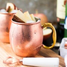 This Apple Cider Irish Mule is a fall twist on the classic! Apple Cider, ginger beer and whiskey make an Autumn cocktail to cozy up with on a cold day!