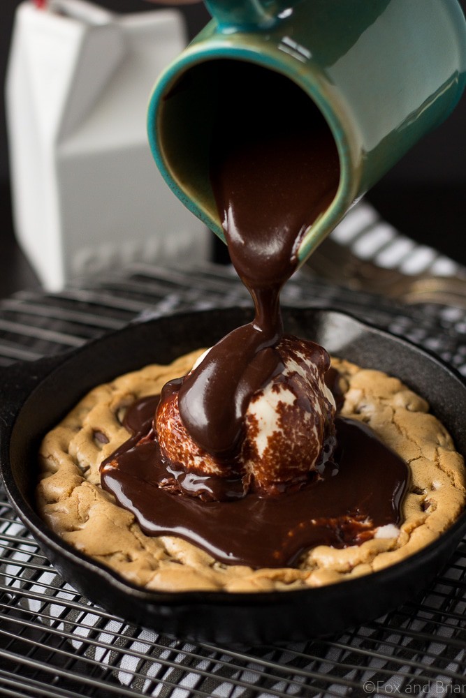 This Chocolate Chip Cookie Blondie Skillet Sundae For Two is the perfect dessert to whip up when you want something sweet but don't want to make a huge batch! A thick and chewy chocolate chip cookie baked in a mini skillet topped with ice cream and a rich chocolate sauce will cure any sweet tooth!