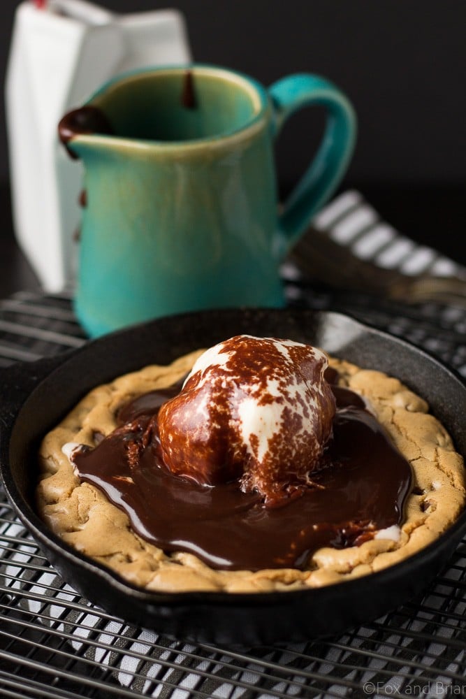 This Chocolate Chip Cookie Blondie Skillet Sundae For Two is the perfect dessert to whip up when you want something sweet but don't want to make a huge batch! A thick and chewy chocolate chip cookie baked in a mini skillet topped with ice cream and a rich chocolate sauce will cure any sweet tooth!