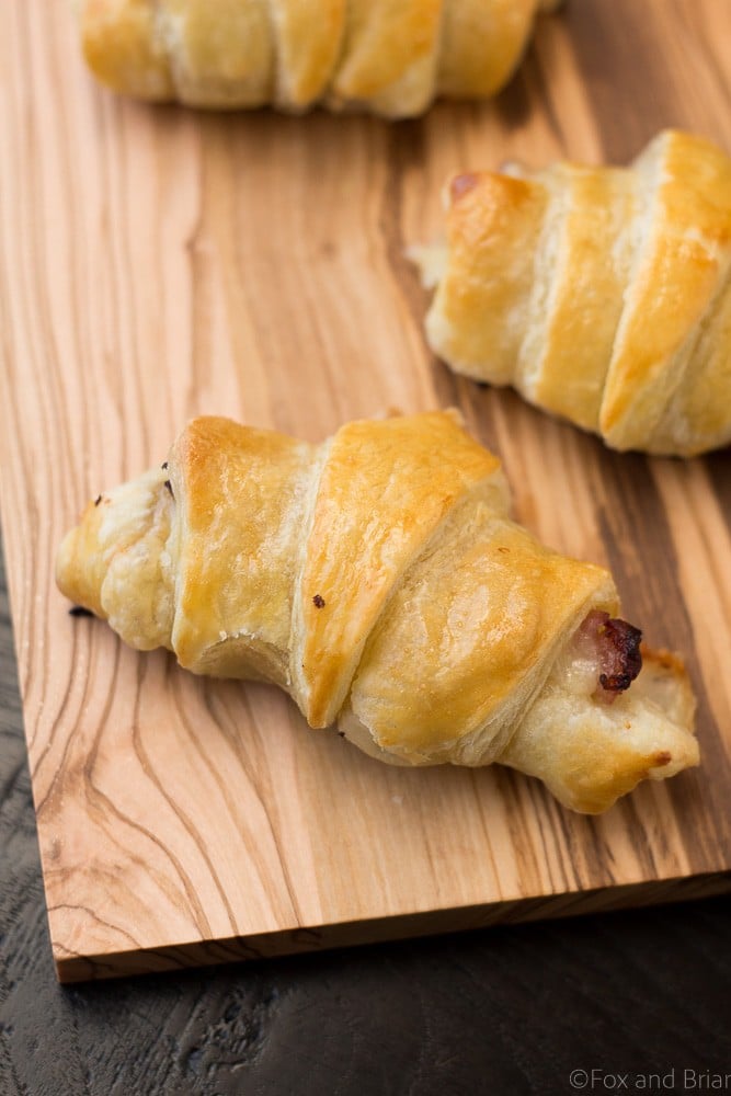 These Easy Ham and Cheese Croissants only use four ingredients and can be made in about 20 minutes! Using ham, Gruyère and puff pastry, they are delicious for breakfast, lunch or dinner. Great for using up leftover ham from the holidays!