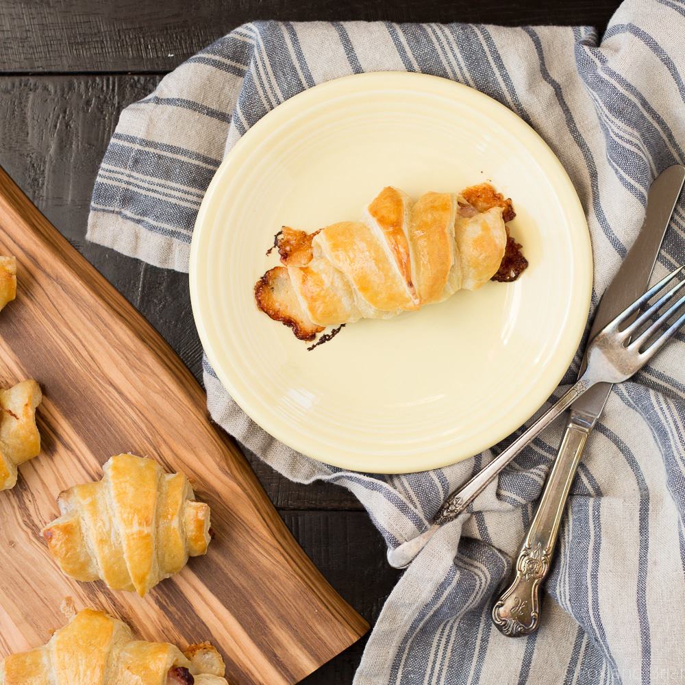 These Easy Ham and Cheese Croissants only use four ingredients and can be made in about 20 minutes! Using ham, Gruyère and puff pastry, they are delicious for breakfast, lunch or dinner. Great for using up leftover ham from the holidays!