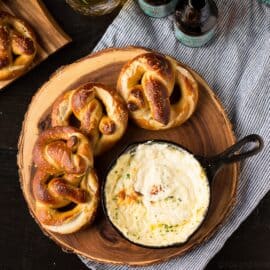 These Soft Beer Pretzels with Beer Cheese Dip are soft and fluffy pretzels with a cheesy dip. Perfect for game day, parties or any time you need a snack.