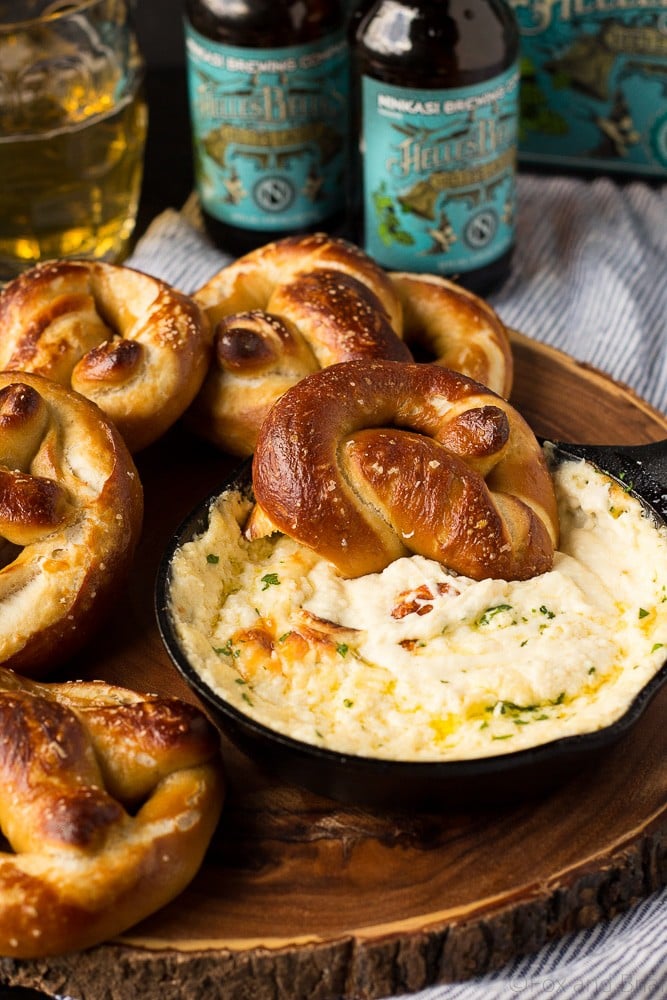 These Soft Beer Pretzels with Beer Cheese Dip are soft and fluffy pretzels with a cheesy dip. Perfect for game day, parties or any time you need a snack. #ad