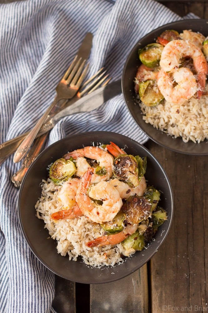 These Roasted Shrimp and Brussels Sprouts are a quick and easy dinner. Lemon and garlic make this a flavorful sheet pan dinner you can make in about 20 minutes!