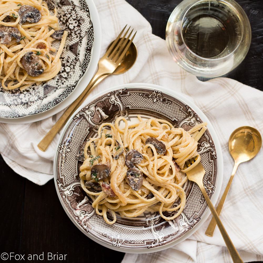 This Creamy Bacon Mushroom Pasta is a perfect date night at home meal, or even just an average weeknight! It is also deceptively fast and easy to make, coming together in under 30 minutes. Savory bacon and mushrooms in a creamy sauce, all tossed together with pasta will have you coming back for seconds!