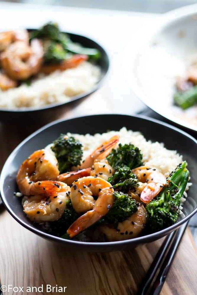 This Honey Sesame Shrimp and Broccoli is a quick and easy dinner. Shrimp and broccoli are quickly sauteed in a sweet and savory sauce that everyone will love! This is great served over rice or noodles, or you can use cauliflower rice or zoodles for a lower carb dinner.