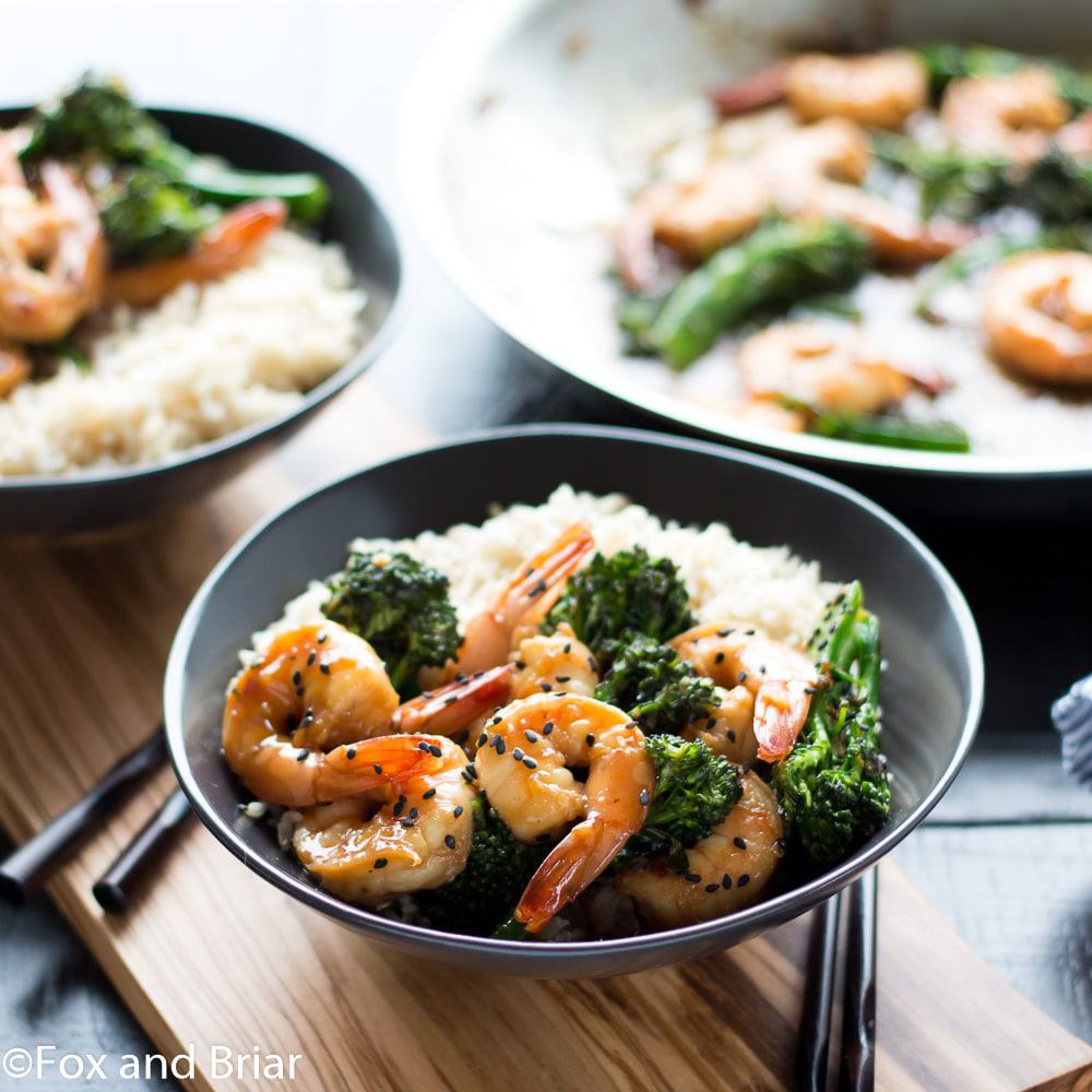 This Honey Sesame Shrimp and Broccoli is a quick and easy dinner. Shrimp and broccoli are quickly sauteed in a sweet and savory sauce that everyone will love! This is great served over rice or noodles, or you can use cauliflower rice or zoodles for a lower carb dinner.