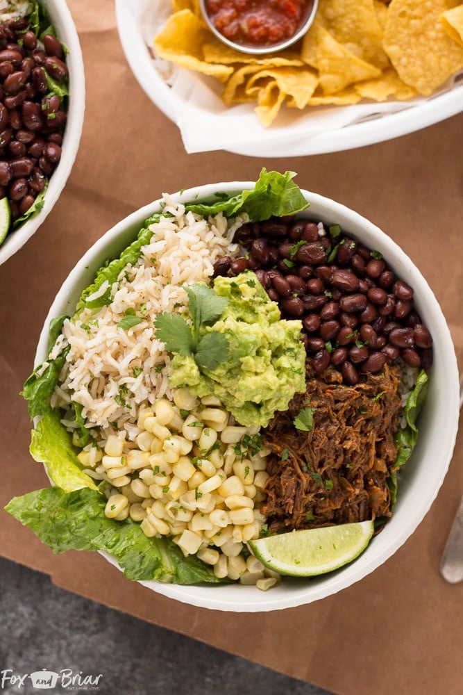 These Slow Cooker Beef Burrito Bowls are a delicious and easy make ahead meal. All ingredients can be prepared ahead of time and putting the burrito bowls together just takes a few minutes. Just like your favorite Chipotle burrito bowl, but better! Gluten free Dairy Free 