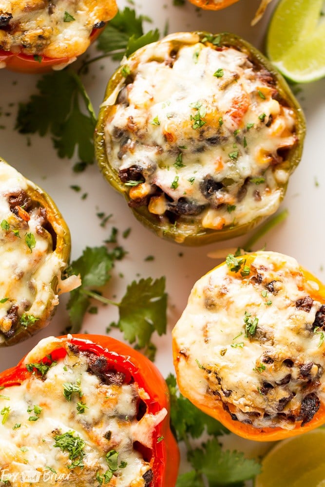 These Tex-Mex Stuffed Bell Peppers are a grain-free, gluten-free family friendly dinner with Mexican flair. Sure to satisfy everyone at the dinner table! #ad @krogerco | Gluten free dinner | Easy Dinner Recipe | Ground Beef Recipes | Stuffed Bell Peppers 